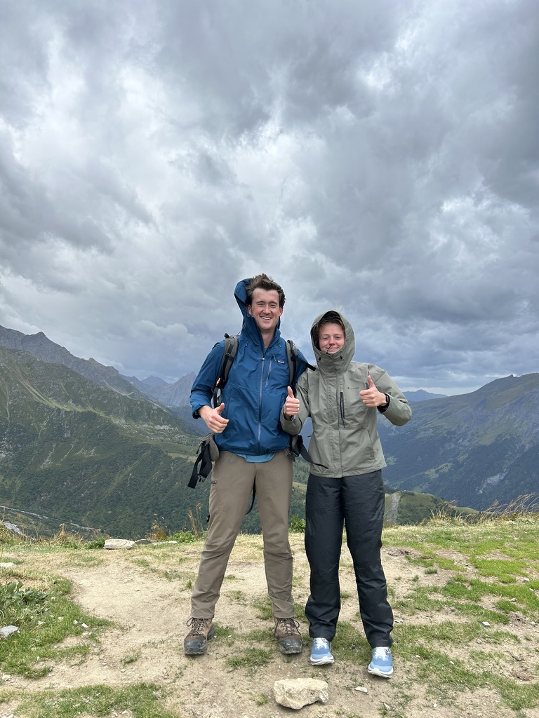 Melissa and William hiking in the Alps, thumbs up